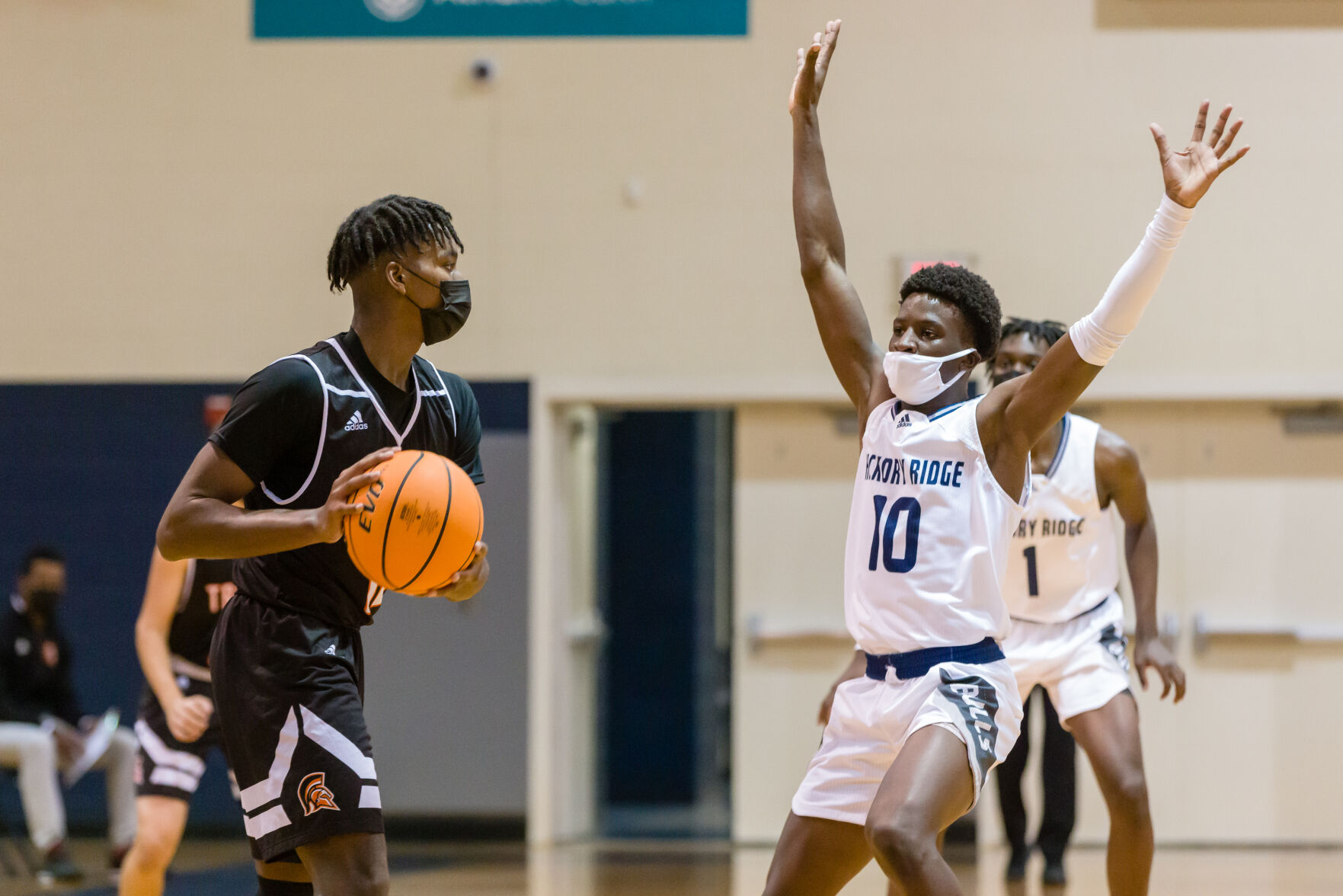 Boys Basketball: Hickory Ridge RaginÕ Bulls defeated the Northwest Cabarrus Trojans 64-56.